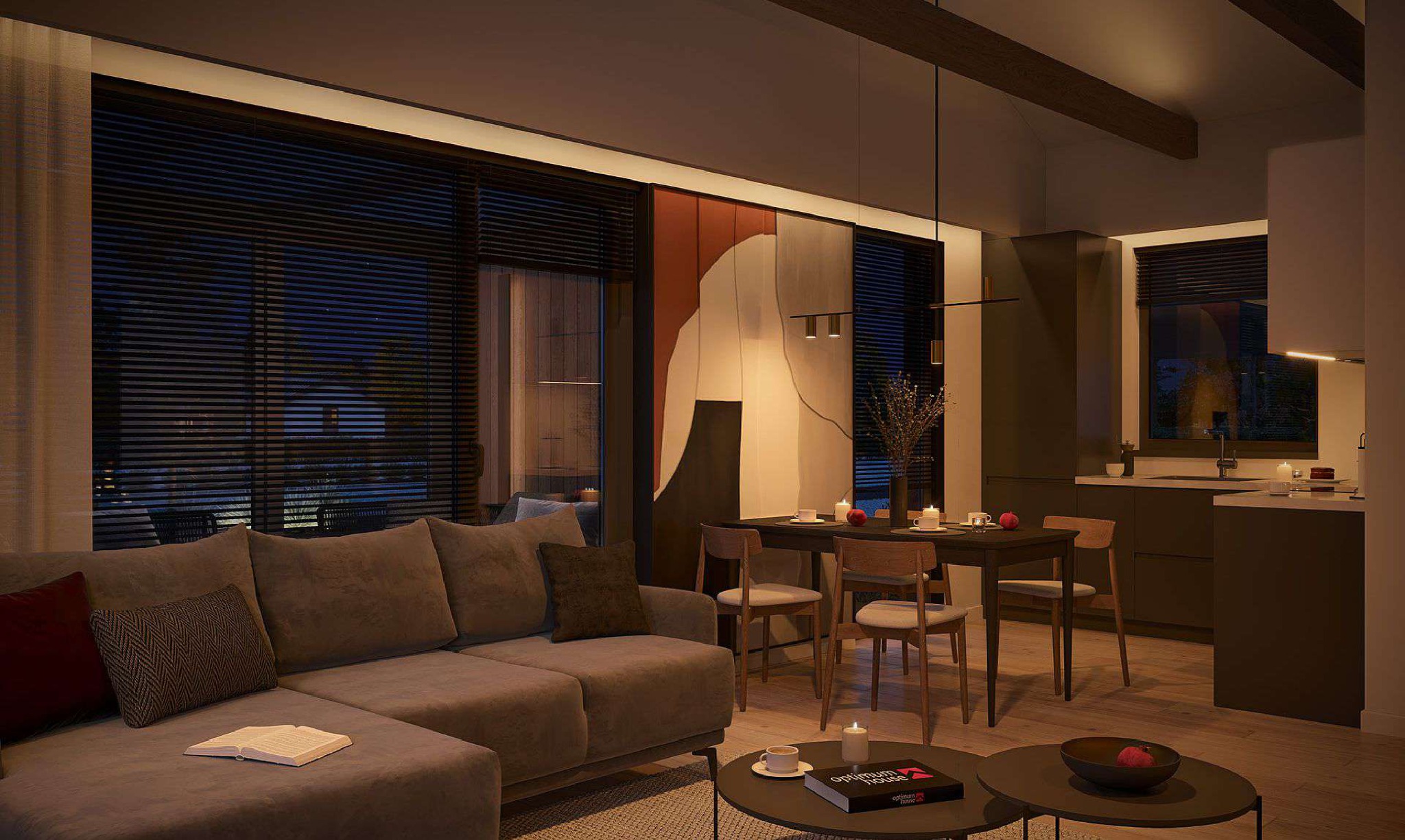 Nowoczesny salon z aneksem kuchennym, oświetlony ciepłym światłem, z dużym oknem przesłoniętym żaluzjami, drewnianymi belkami stropowymi i abstrakcyjnym obrazem na ścianie.