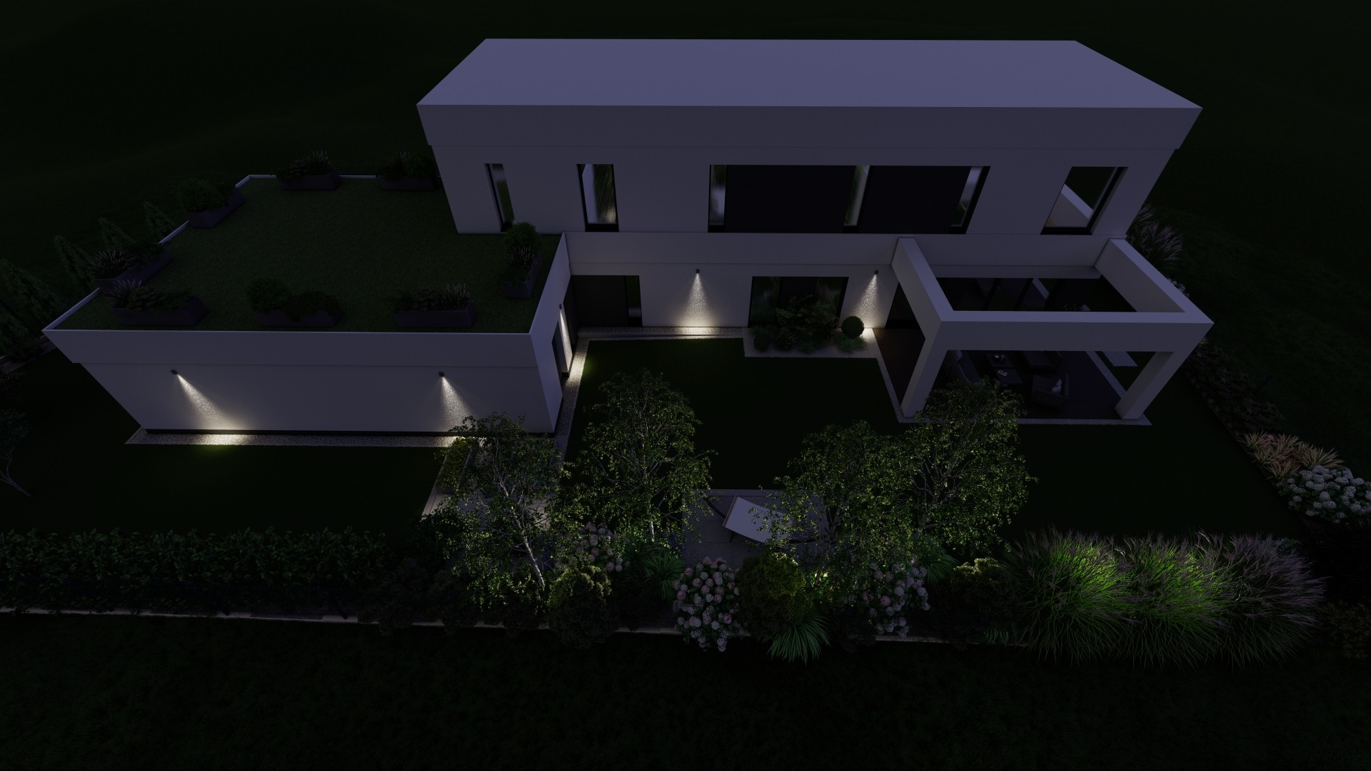 Nocny widok z góry na nowoczesny dom z płaskim dachem, zielonym dachem z roślinami w donicach, oświetlonym ogrodem z drzewami, krzewami i trawnikiem, oraz zadaszonym tarasem z meblami ogrodowymi.