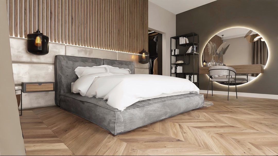 Nowoczesna sypialnia z łóżkiem na niskiej platformie, parkietem w jodełkę i toaletką z okrągłym lustrem z podświetleniem LED