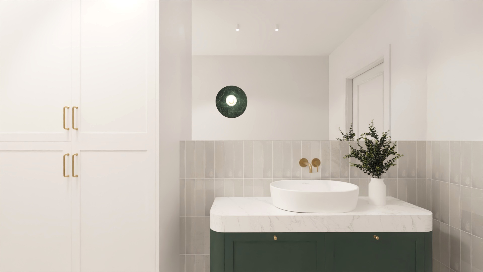 Nowoczesna łazienka z białą umywalką nablatową, zieloną szafką z marmurowym blatem, złotą armaturą i szarą glazurą ułożoną pionowo.