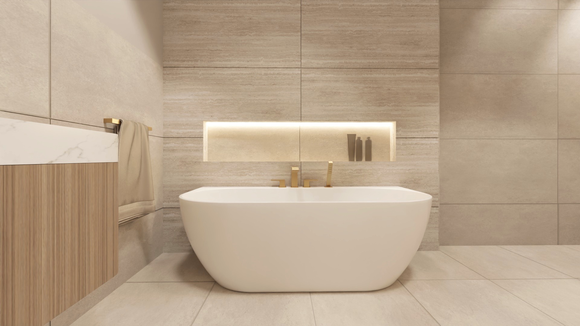 Nowoczesna łazienka z wolnostojącą białą wanną, złotą armaturą i podświetlaną niszą w ścianie wyłożonej beżowymi płytkami imitującymi kamień.
