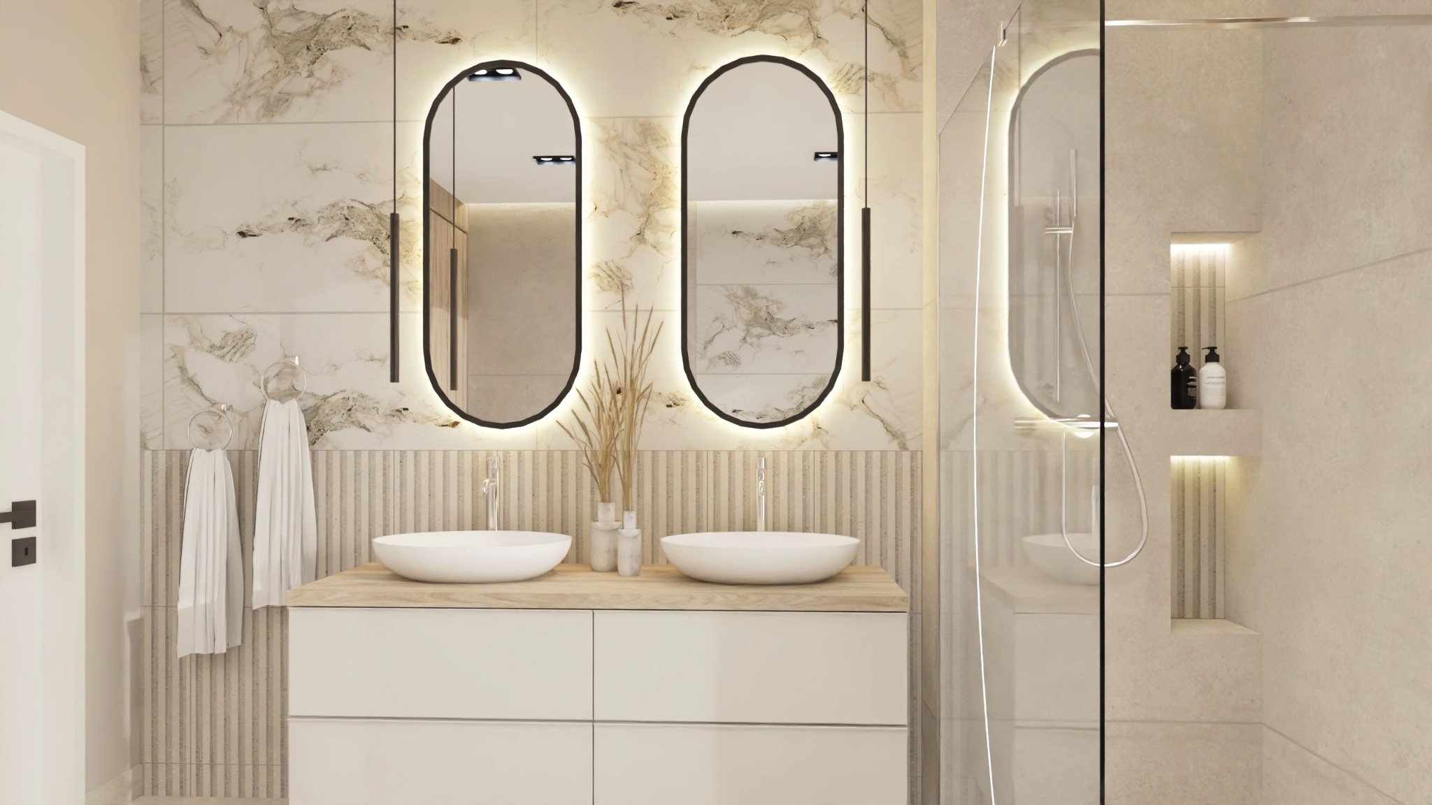 Nowoczesna łazienka z dwoma owalnymi lustrami podświetlanymi LED, umywalkami nablatowymi na drewnianym blacie, i kabiną prysznicową ze szklaną ścianką.