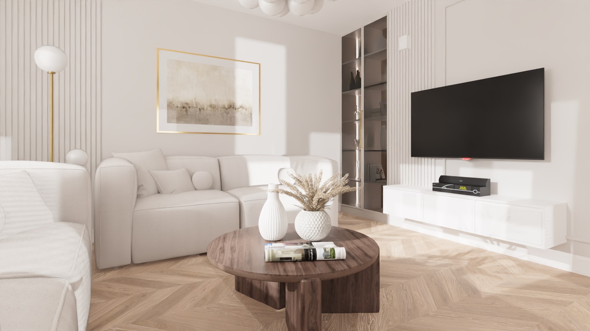 Jasne wnętrze salonu z białymi sofami, telewizorem na ścianie i okrągłym stolikiem kawowym z wazonami i gazetami.