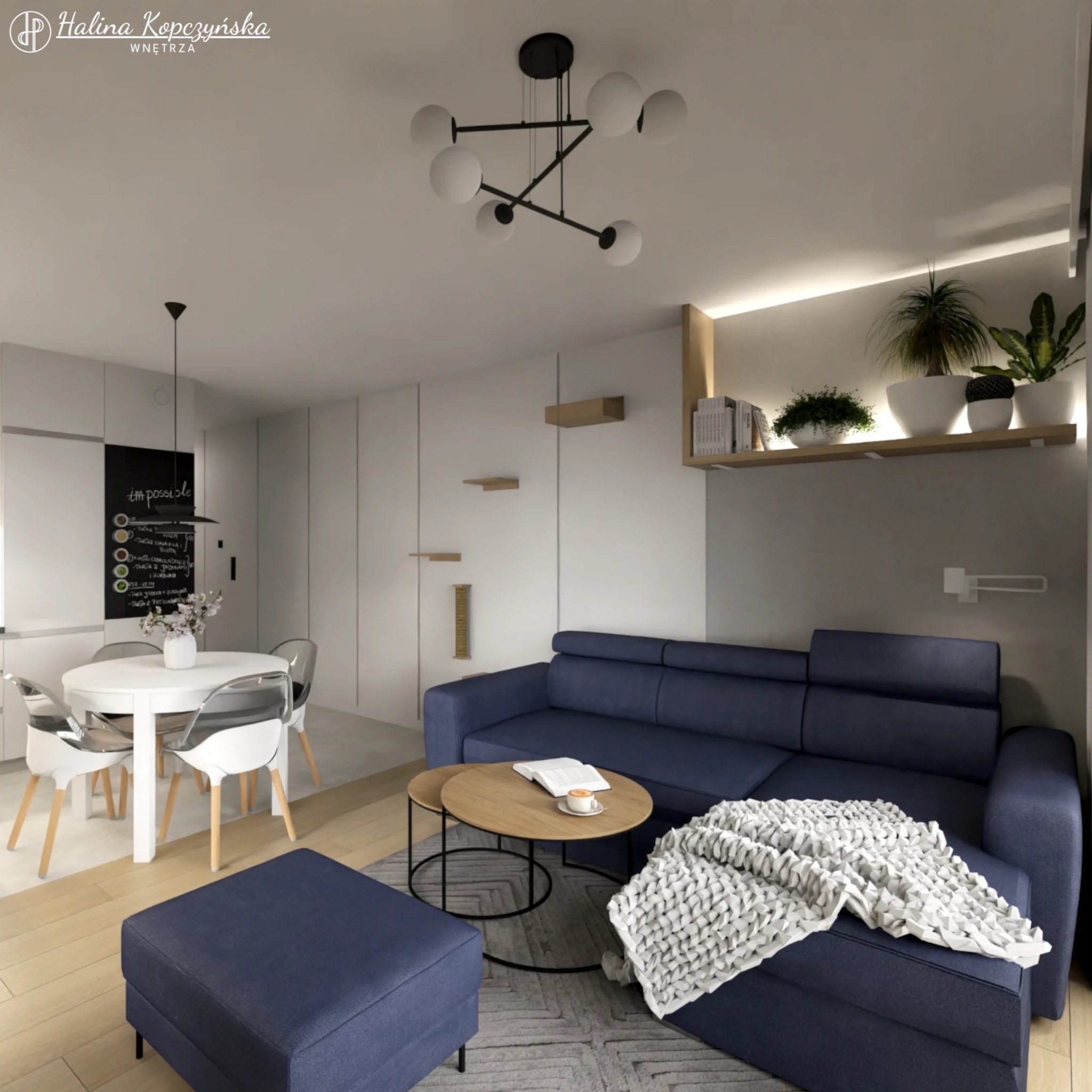 Wnętrze mieszkania w stylu nowoczesnym: granatowa sofa narożna z pufem, okrągły stolik kawowy z książką i filiżanką, biały stół z krzesłami w jadalni, czarna tablica kredowa z menu, oświetlenie...