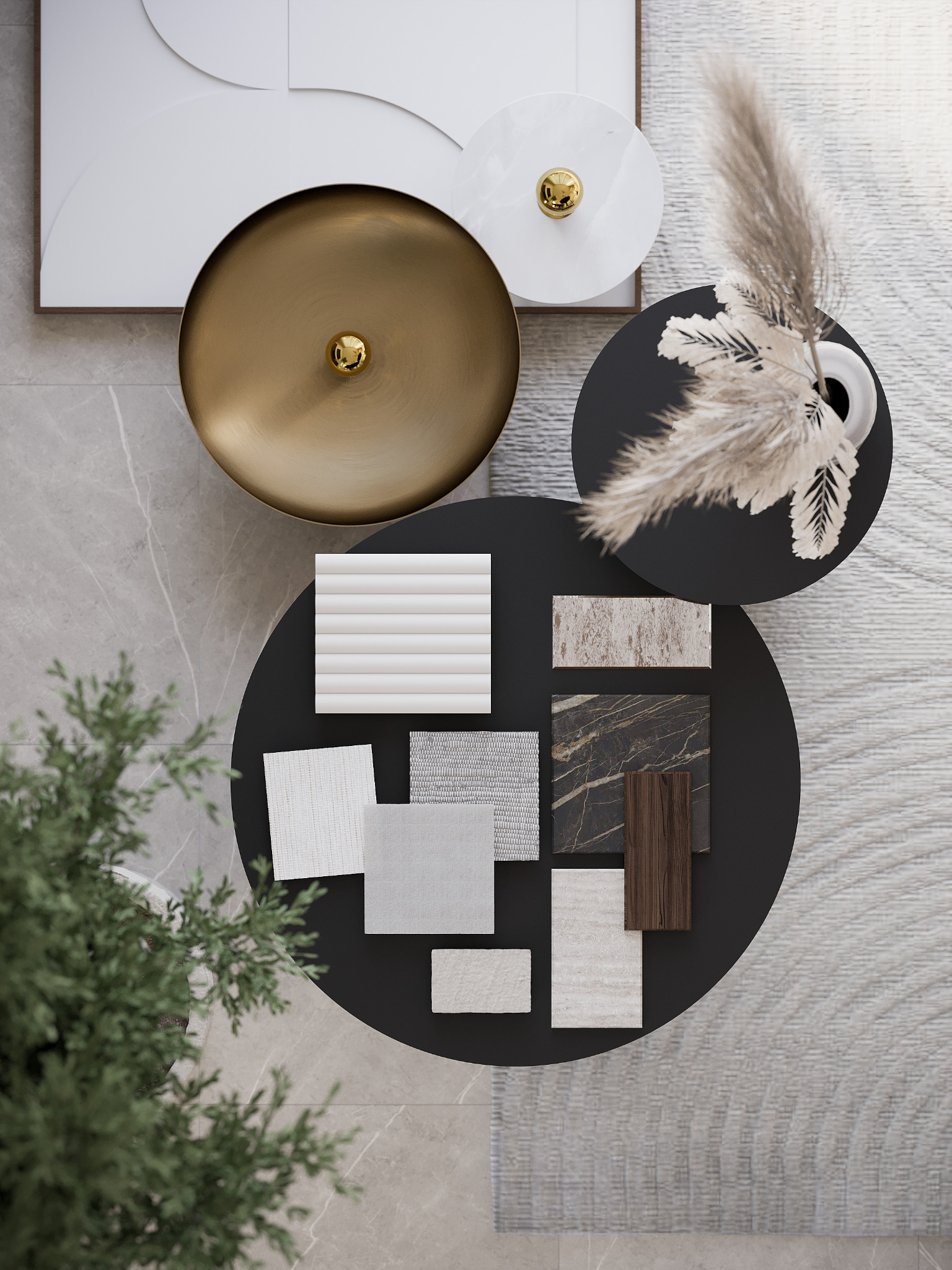Moodboard z próbkami materiałów wykończeniowych (drewno, marmur, tkaniny) na czarnym stoliku kawowym, uzupełniony o dekoracje: wazon z pampasową trawą, złota misa i abstrakcyjny obraz, widok z góry.