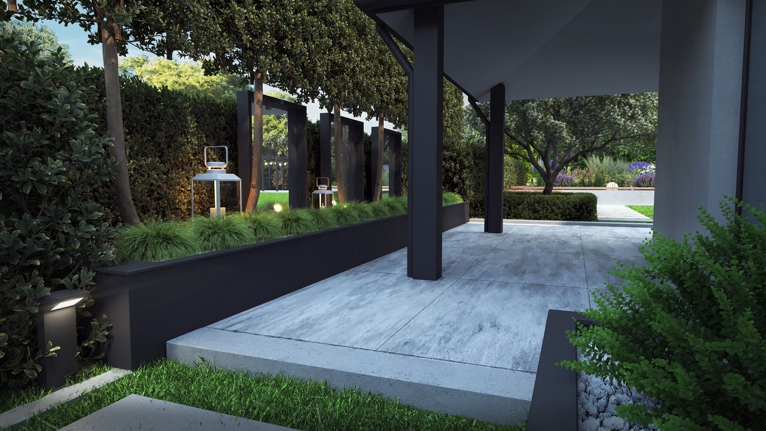 Nowoczesny taras z betonową posadzką, minimalistycznymi lampami i dekoracyjnymi trawami, widok na zadbany ogród z kwitnącymi rabatami.