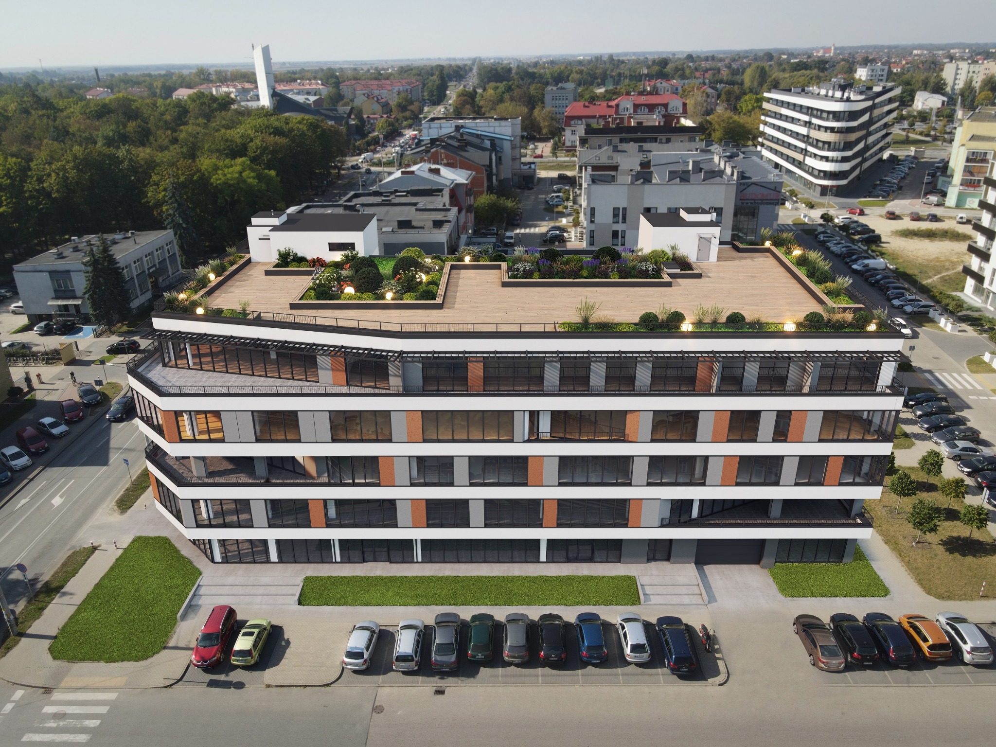 Wizualizacja nowoczesnego budynku biurowego z zielonym tarasem na dachu, widok z lotu ptaka na otoczenie miejskie.