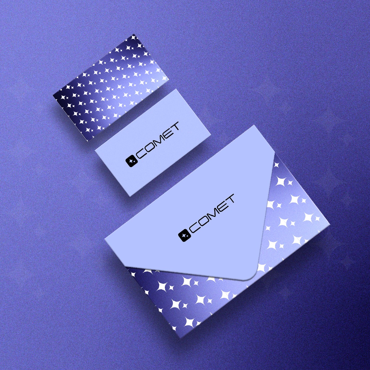 Wizualizacja firmowej papeterii: koperta, wizytówka i karta z motywem gwiazd, z logo 'COMET' na fioletowym tle.