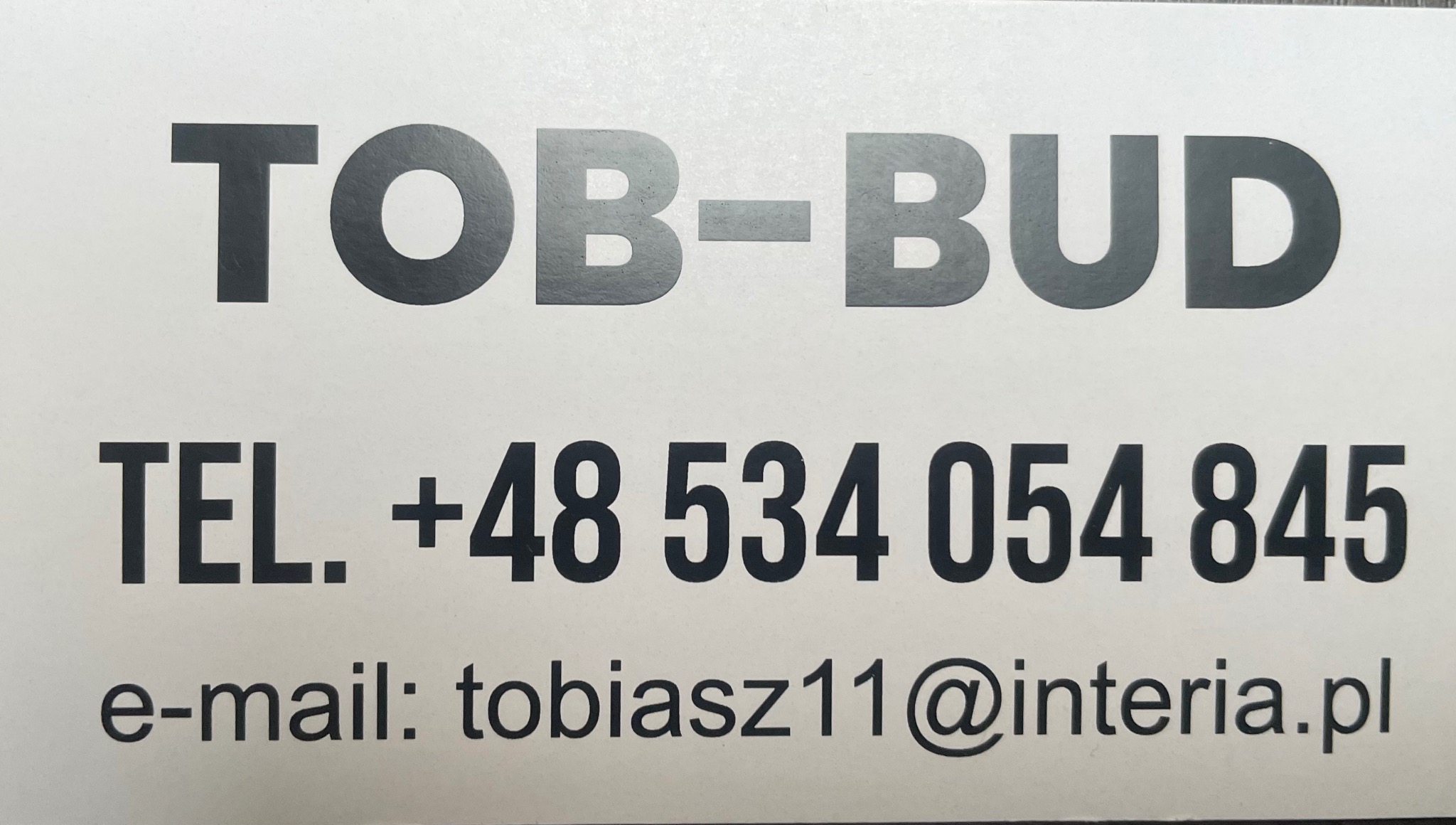 Wizytówka firmy budowlanej TOB-BUD z numerem telefonu +48 534 054 845 i adresem e-mail tobiasz11@interia.pl.