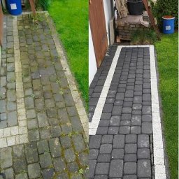 Myjnia mobilna - Efekt mycia kostki brukowej: po lewej zaniedbana, po prawej czysta, ciemnoszara kostka z białymi obrzeżami. Widoczne trawnik i elementy otoczenia.