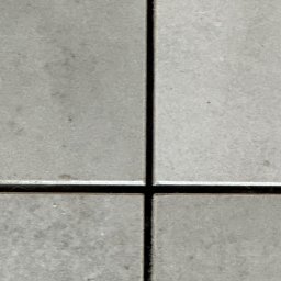 valentyn haliev - Zbliżenie na cztery szare płytki podłogowe z ciemnymi fugami tworzącymi krzyż.