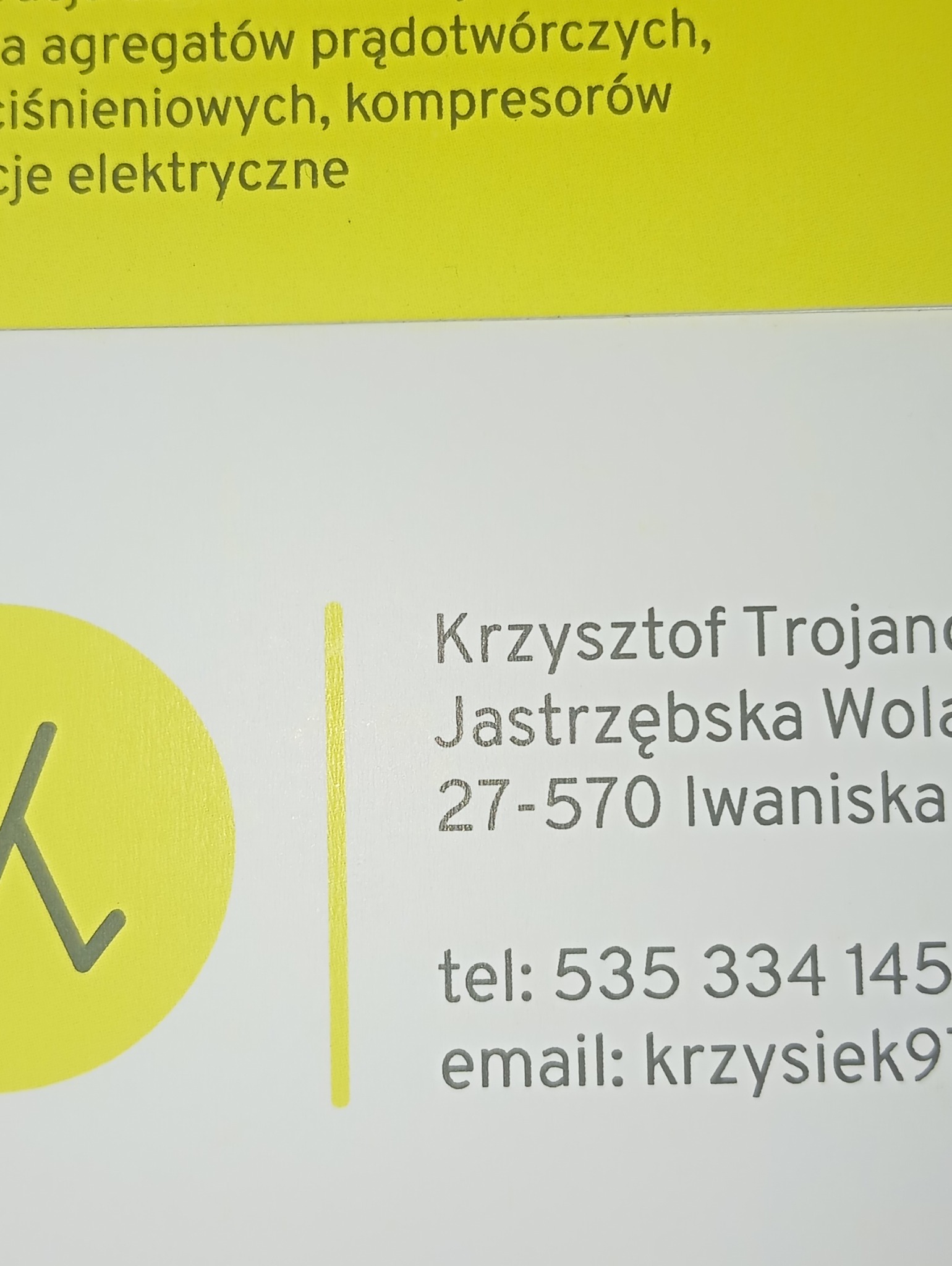 Wizytówka firmy Krzysztof Trojan, Jastrzębska Wola, oferującej usługi związane z agregatami prądotwórczymi, ciśnieniowymi i kompresorami, z dopiskiem 'cje elektryczne', widoczny adres, telefon...