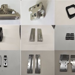 MARIUMAX MARIUSZ DARNOWSKI - Kolekcja dziewięciu precyzyjnie obrobionych, metalowych i plastikowych komponentów na białym tle, ukazująca różnorodność kształtów i detali wykonanych metodą CNC.