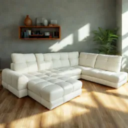 Jasny, modułowy narożnik tapicerowany z pikowanymi siedziskami w przestronnym salonie z drewnianą podłogą i roślinami doniczkowymi, oświetlony naturalnym światłem.