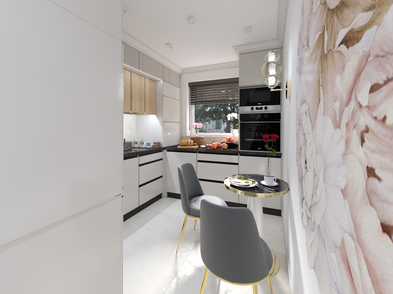 Nowoczesna kuchnia z białymi szafkami, czarnym blatem i okrągłym stolikiem z szarymi krzesłami. Na ścianie dekoracja z motywem kwiatowym. Widok na okno z roletami.