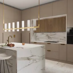 Nowoczesna kuchnia w beżach z marmurową wyspą, złotą armaturą i wiszącą lampą z mlecznymi kloszami. Na blacie wyspy leżą orzechy włoskie i gałązka z liśćmi.