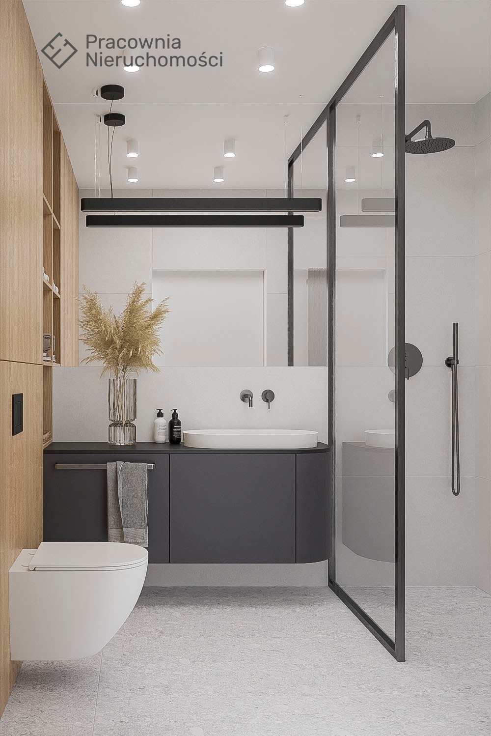 Minimalistyczna łazienka z kabiną prysznicową typu walk-in, wiszącą toaletą, umywalką nablatową i szarą szafką pod umywalką, oświetlona podłużną lampą LED.