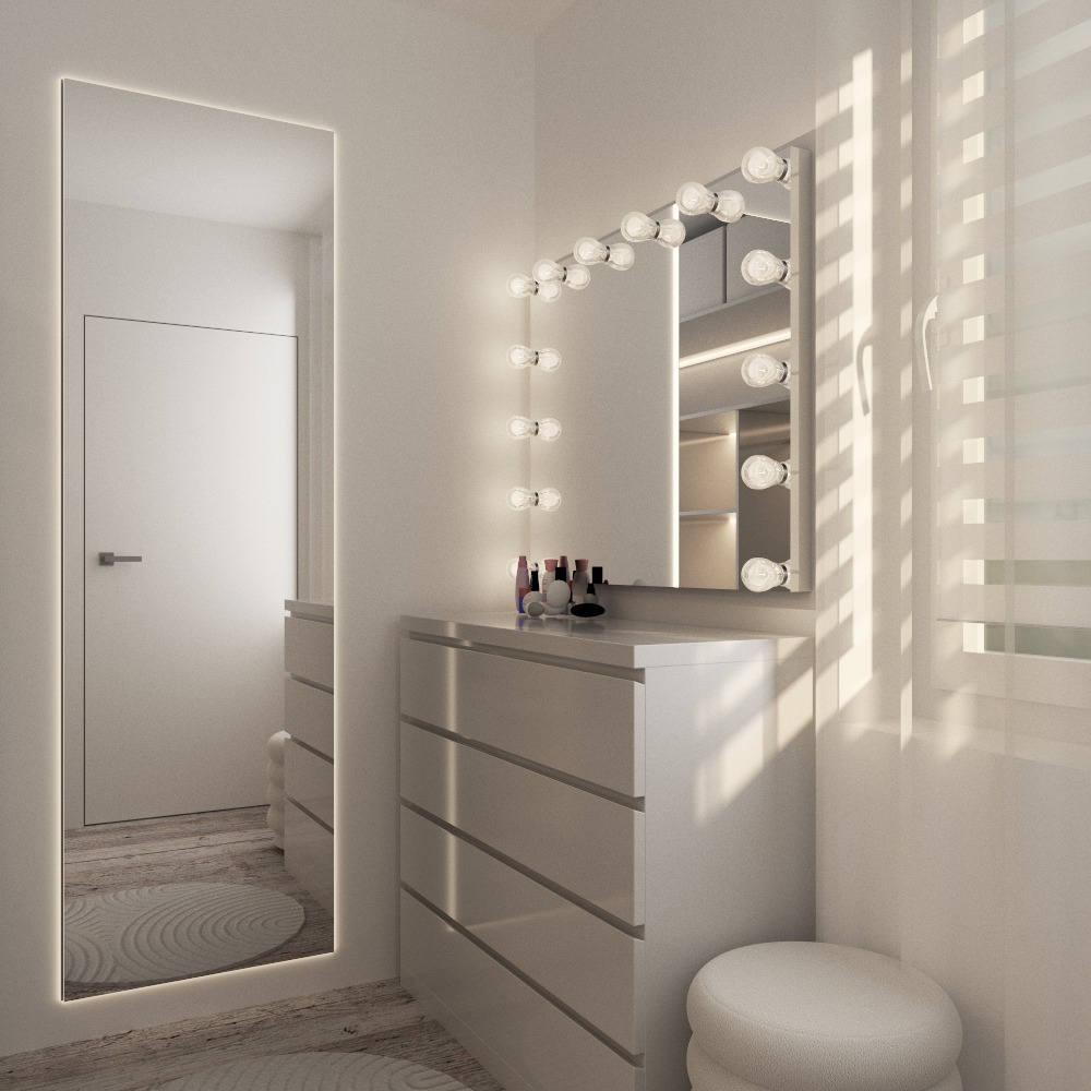 Jasna toaletka z lustrem podświetlanym żarówkami, biała komoda z szufladami i pufa w minimalistycznym, nowoczesnym wnętrzu. Widoczne kosmetyki i fragment okna.