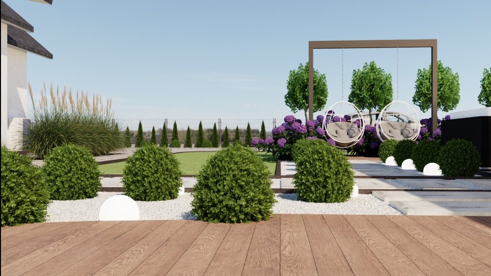 Wizualizacja ogrodu z drewnianym tarasem, kulistymi krzewami, białym żwirem i huśtawkami w kształcie kuli. W tle widoczne drzewa i fioletowe kwiaty.
