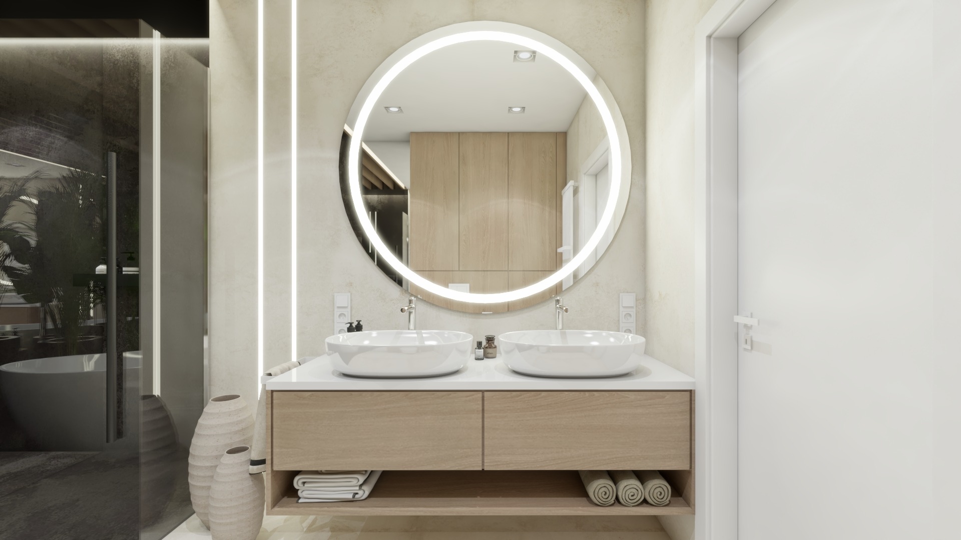Nowoczesna łazienka z dwoma umywalkami nablatowymi, okrągłym lustrem z podświetleniem LED, drewnianą szafką podumywalkową i dekoracyjnymi wazonami ceramicznymi obok szklanej kabiny prysznicowej.