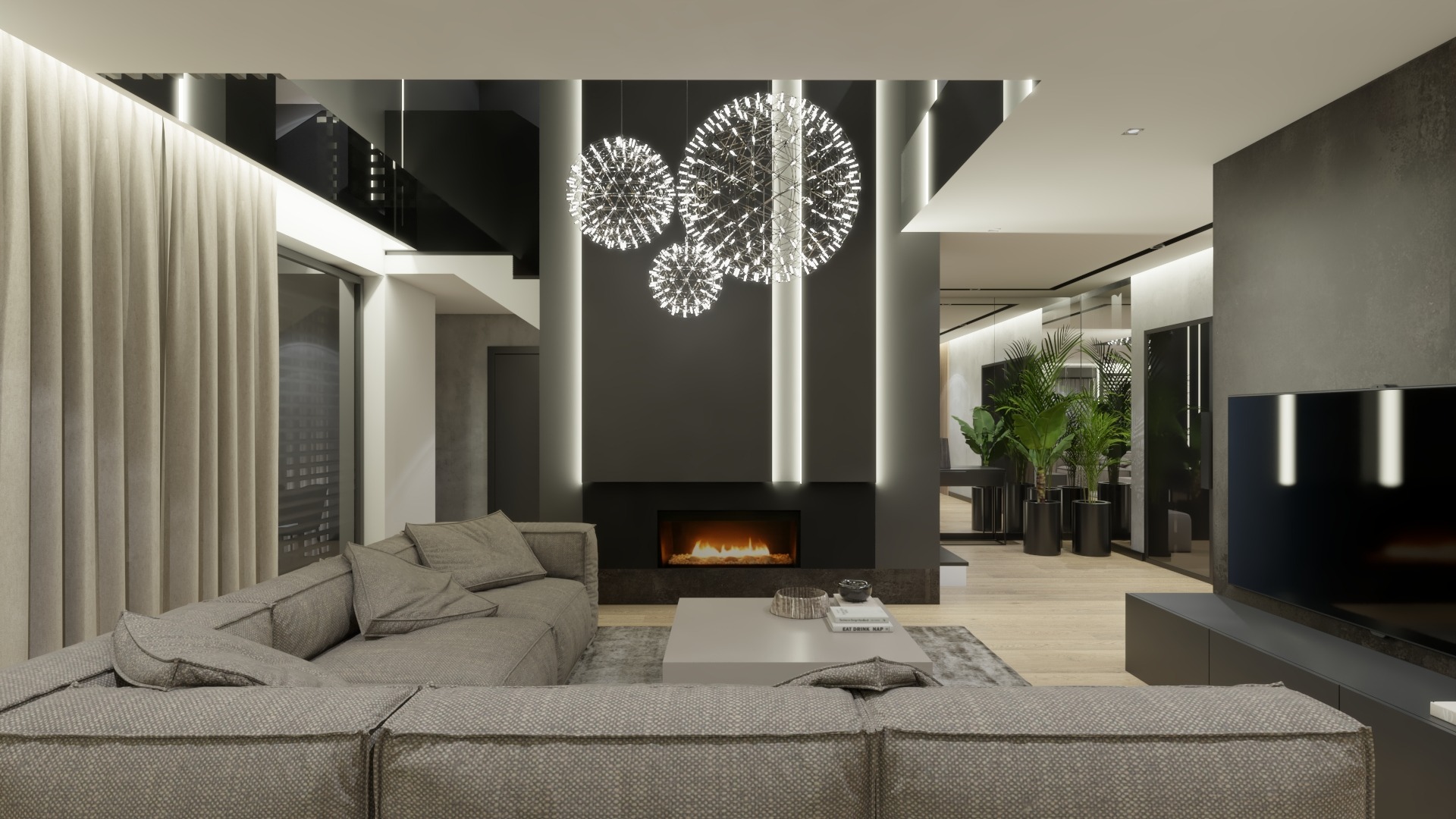 Nowoczesny salon z szarą, modułową sofą, kominkiem podświetlonym trzema kulistymi lampami i roślinami doniczkowymi w tle.