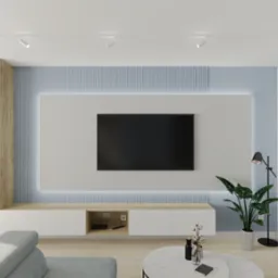 Nowoczesny salon z telewizorem na ścianie z podświetleniem LED, białe meble, drewniane akcenty i roślina doniczkowa. Minimalistyczny design.