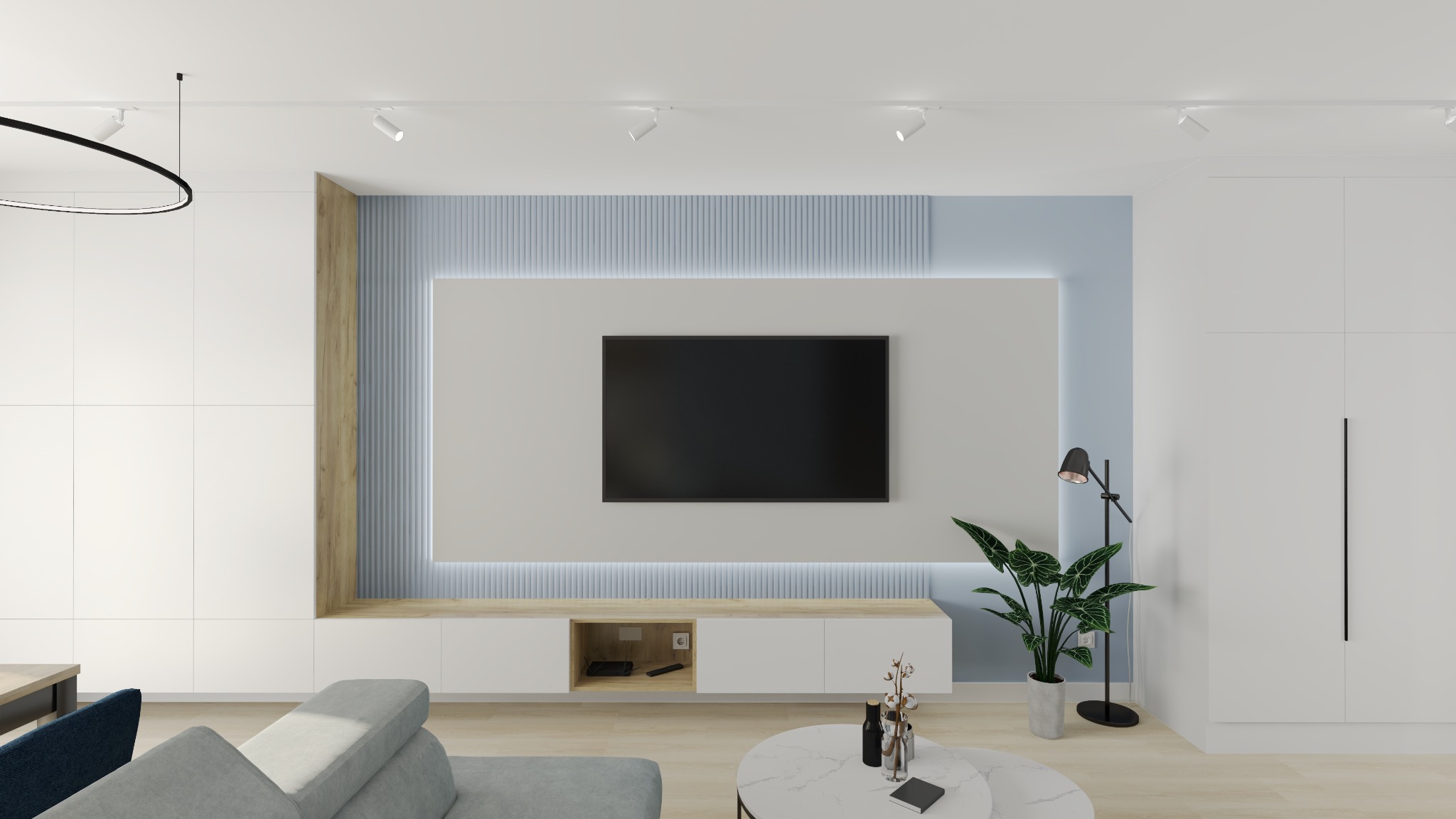 Nowoczesny salon z telewizorem na ścianie z podświetleniem LED, białe meble, drewniane akcenty i roślina doniczkowa. Minimalistyczny design.