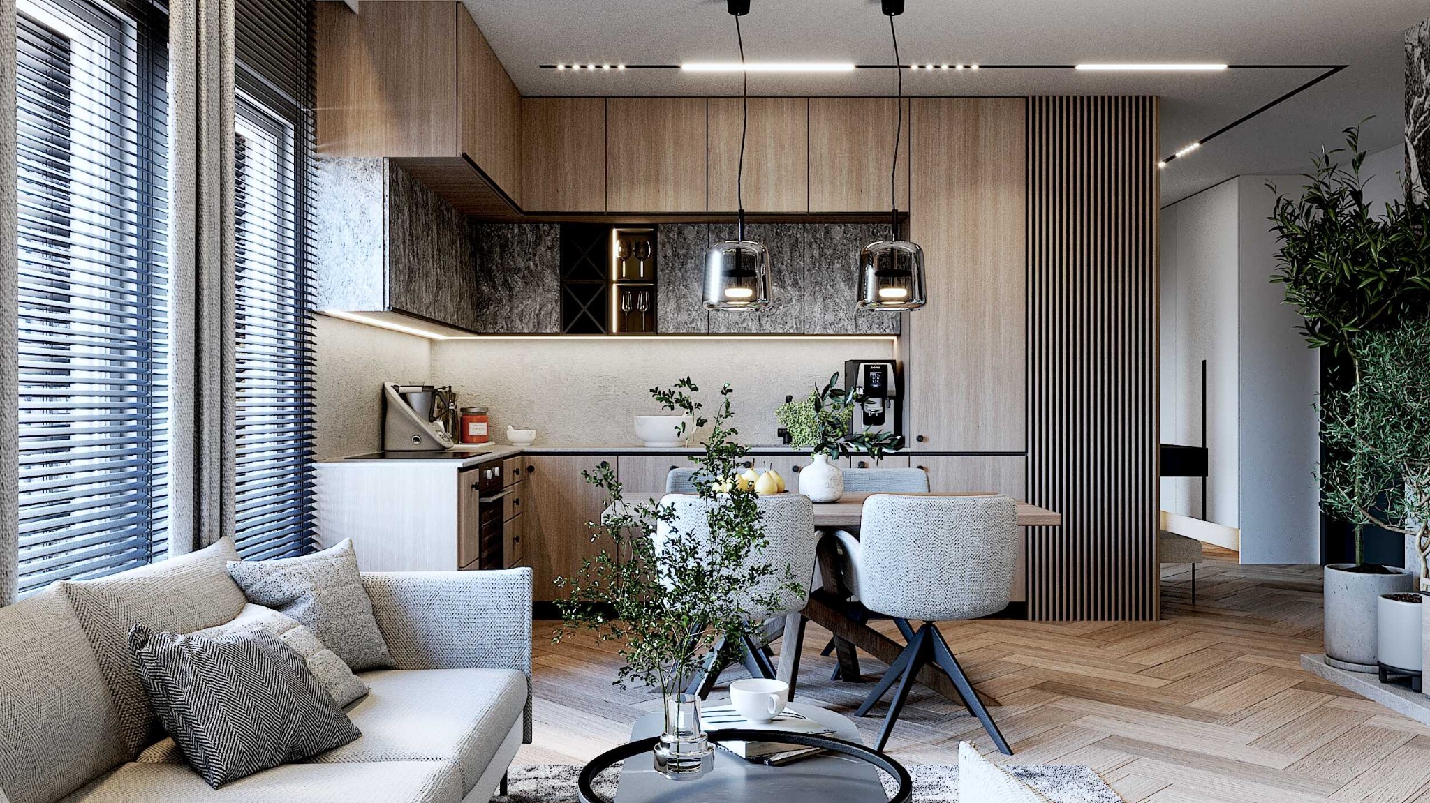 Nowoczesne wykończenie wnętrza mieszkania w Tychach: salon z aneksem kuchennym, drewniane panele na podłodze ułożone w jodełkę, drewniane szafki kuchenne, szare blaty i dekoracyjne oświetlenie.