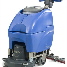 ANS Clean Craft Sprzątanie Profesjonalne i Ozonowanie - Profesjonalna, kompaktowa szorowarka do podłóg Numatic, z niebieską obudową i szarymi elementami, na białym tle. Widoczne szczotki i elementy czyszczące.