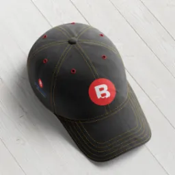 Czarna czapka z daszkiem z czerwonym logo litery B na białym tle, leżąca na białych drewnianych deskach.