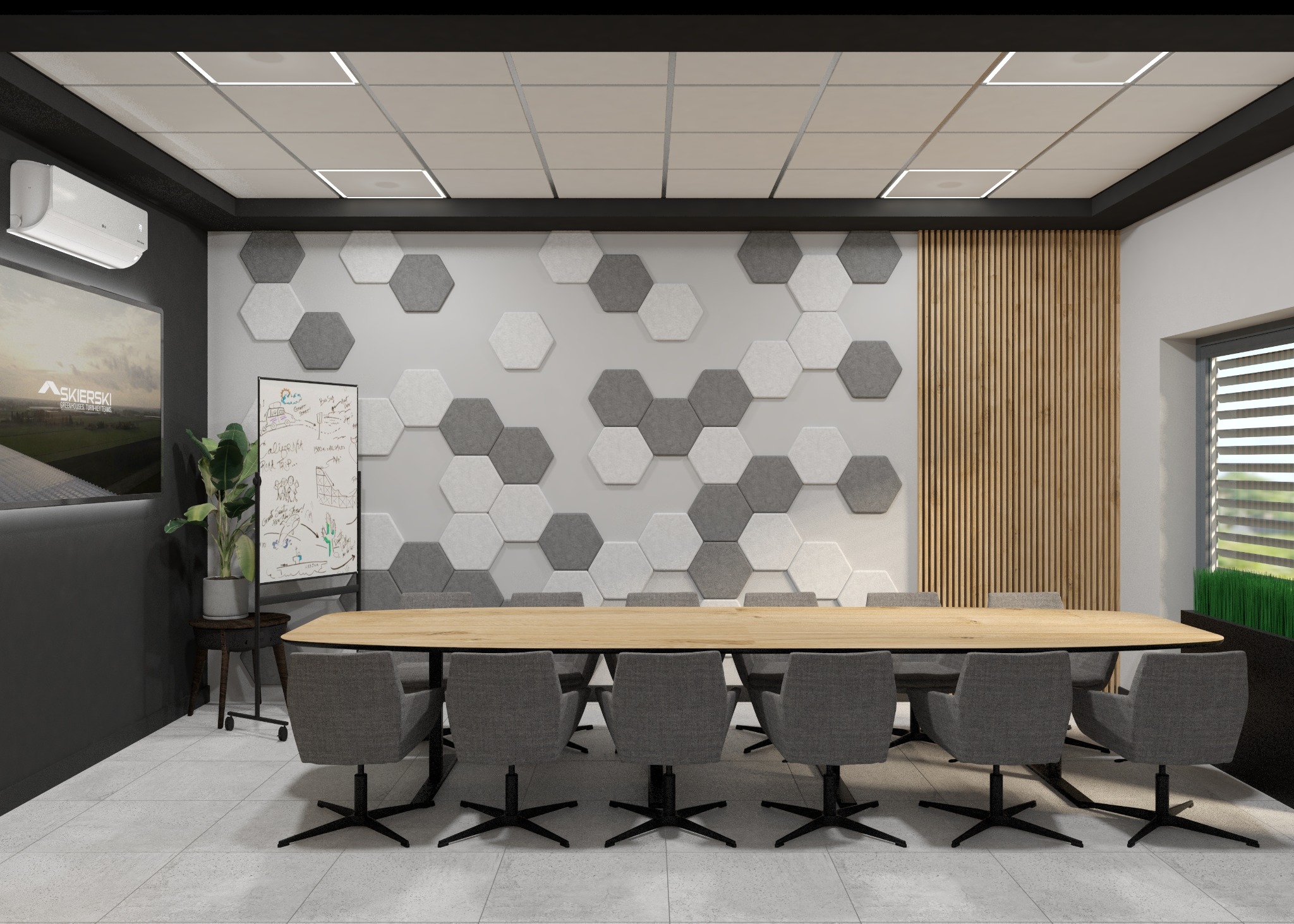 Sala konferencyjna z długim, drewnianym stołem i szarymi krzesłami, ściana z dekoracyjnymi panelami w kształcie szarych i białych heksagonów oraz tablicą suchościeralną z kolorowymi rysunkami.
