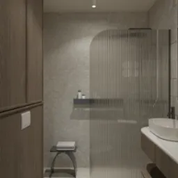 Minimalistyczna łazienka w odcieniach szarości z kabiną prysznicową z ryflowanego szkła, umywalką nablatową i drewnianą szafką, akcentowana półką z kosmetykami i designerskim stołkiem z ręcznikami.