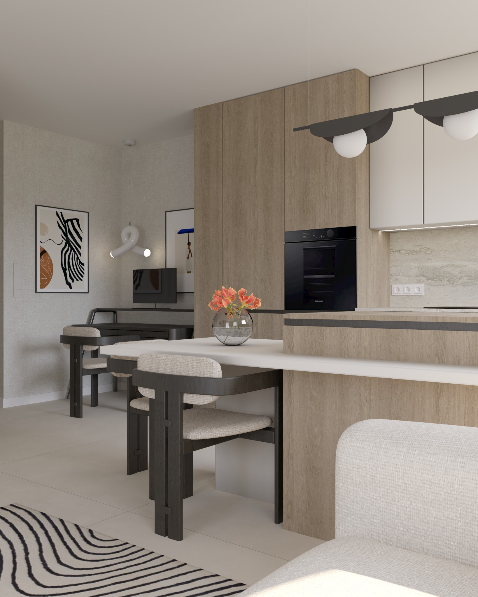 Wnętrze mieszkania z otwartą kuchnią, jadalnią i biurem; ciemne krzesła i stół jadalny z kwiatami, w tle biurko z komputerem, nad stołem lampa z dwoma białymi kulami.