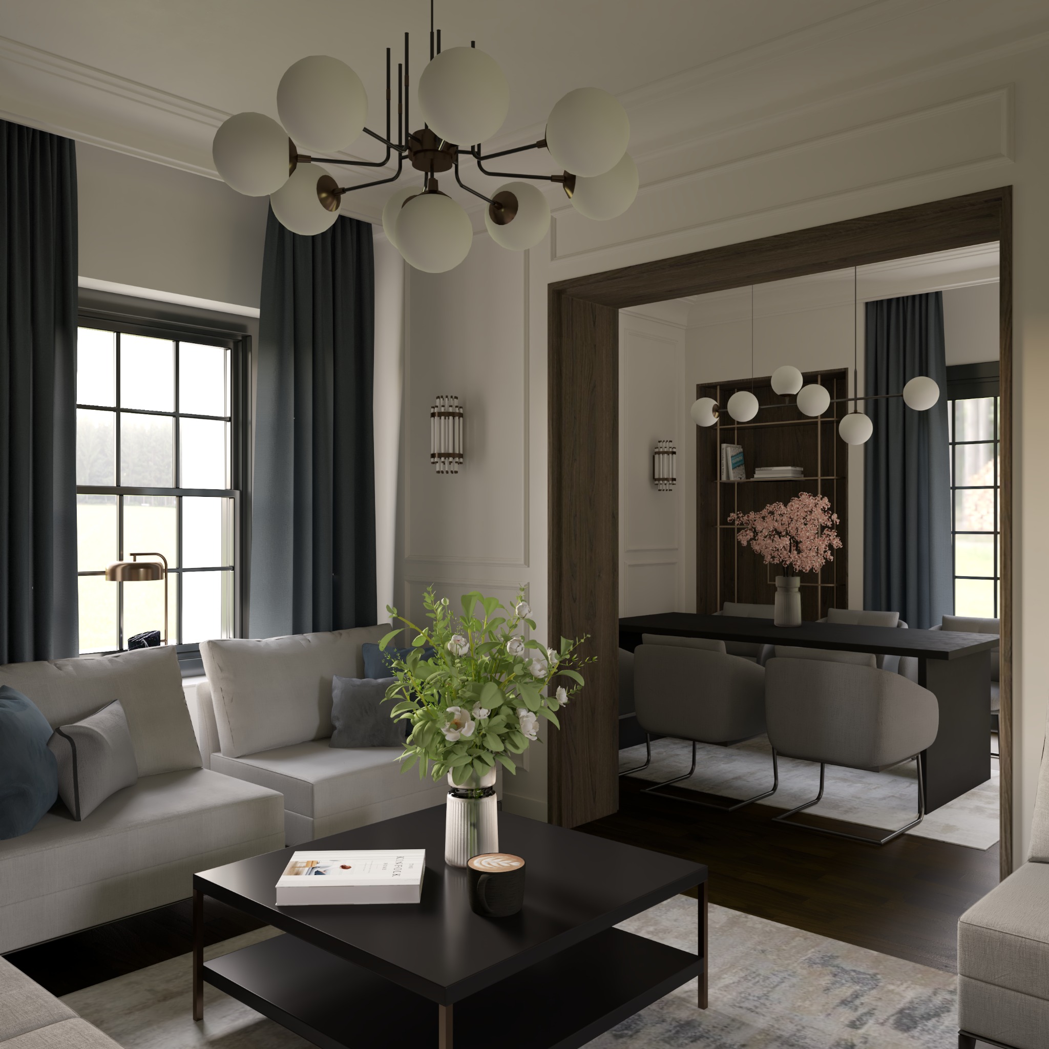 Salon z szarymi sofami, czarnym stolikiem kawowym z książką i kawą, oraz jadalnią w tle, oświetlony nowoczesnym żyrandolem i kinkietami.