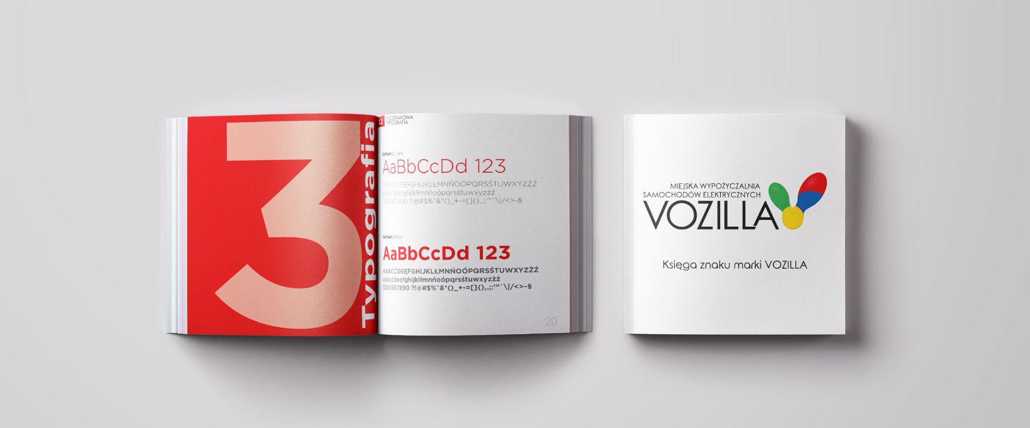 Dwie otwarte książki: jedna z czerwonym napisem 'Typografia' i przykładami fontów, druga z logo firmy 'Vozilla' i napisem 'Księga znaku marki Vozilla'.