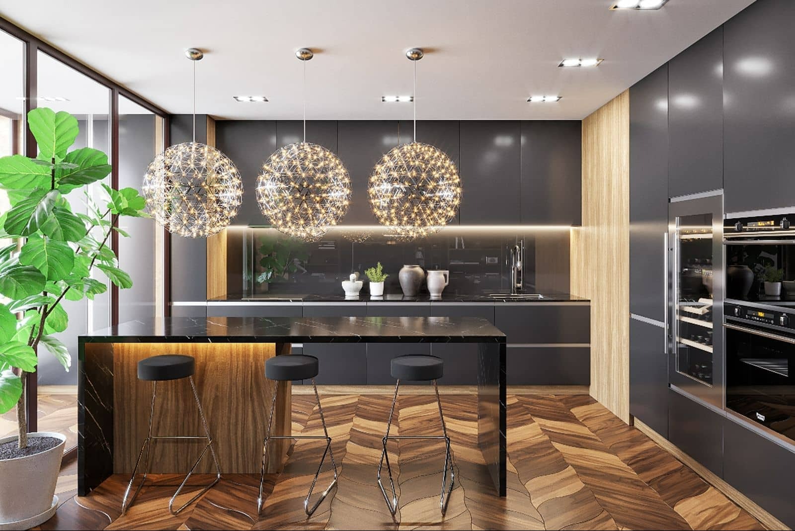 Nowoczesna kuchnia z wyspą, trzema kulistymi lampami, drewnianą podłogą w jodełkę i dużą rośliną doniczkową przy oknie.