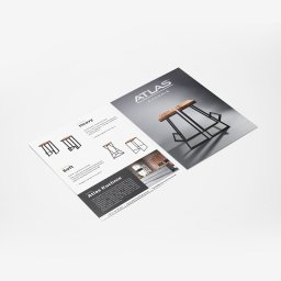 Reklama Karol Dolata - Dwa katalogi produktowe Atlas Kuchnie: jeden z modelami krzeseł barowych Heavy i Soft, drugi z krzesłami Heavy na szarym tle.