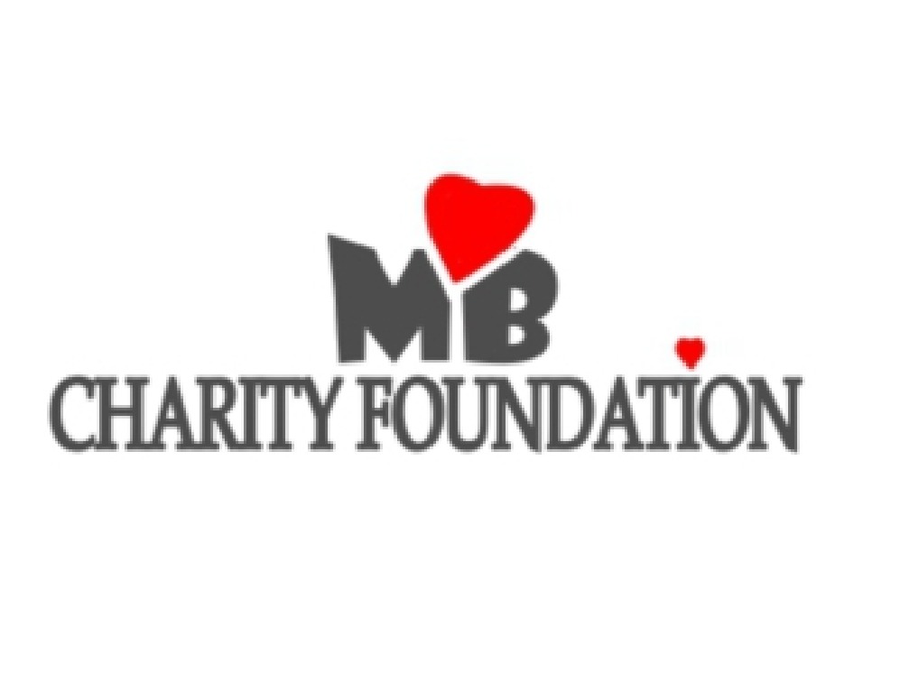 Logo organizacji charytatywnej 'MYB Charity Foundation' z czerwonym sercem nad napisem 'MYB' oraz małym sercem obok napisu 'CHARITY FOUNDATION', wszystko na białym tle.