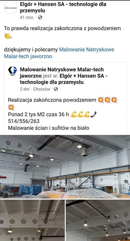 Wnętrze hali przemysłowej po natryskowym pomalowaniu ścian i sufitów na biało, widoczne instalacje pod sufitem i zabezpieczone folią elementy wyposażenia.