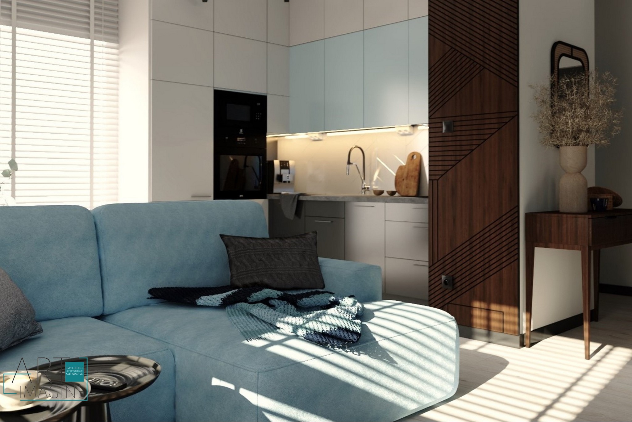 Nowoczesne wnętrze: błękitna sofa narożna z poduszką i pledem w salonie z aneksem kuchennym, drewniana ściana z geometrycznym wzorem i konsola z lustrem.