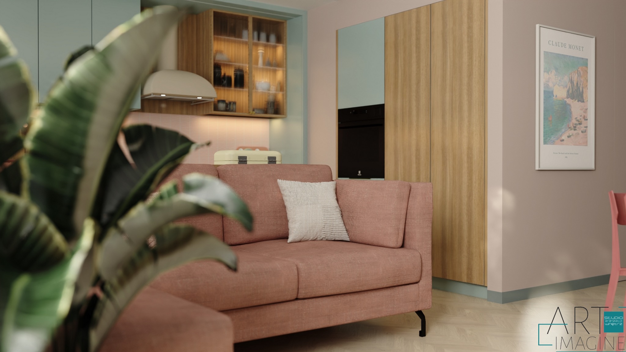 Różowa sofa z poduszką w salonie z aneksem kuchennym, widok na zabudowę kuchenną z oświetleniem i plakat Claude'a Moneta na ścianie.