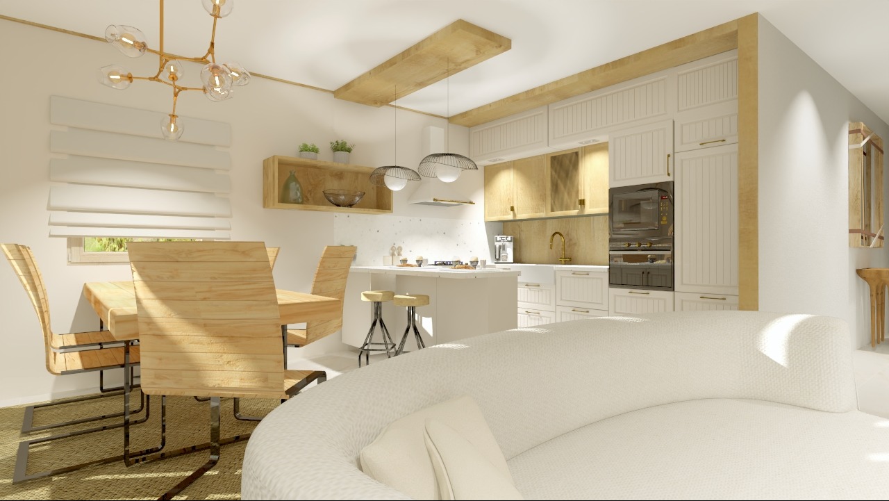 Jasna kuchnia z wyspą, drewnianym stołem i krzesłami oraz nowoczesnym oświetleniem, widok zza białej sofy.
