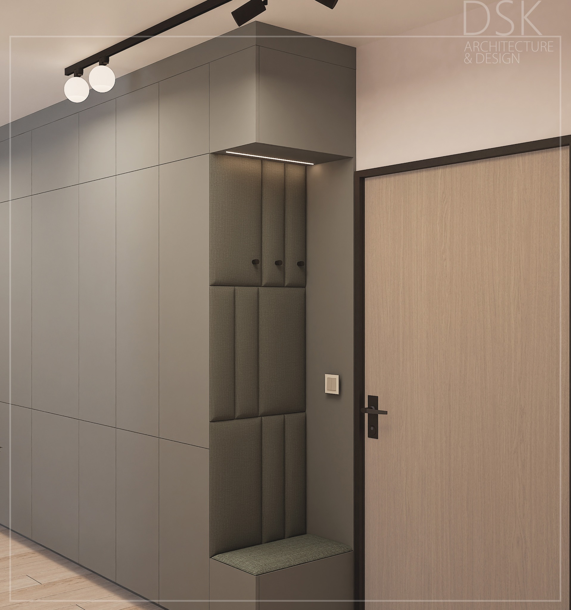 Nowoczesna aranżacja przedpokoju z szarą zabudową szafy, siedziskiem i oświetleniem punktowym. Minimalistyczny design z drewnianymi akcentami drzwi.