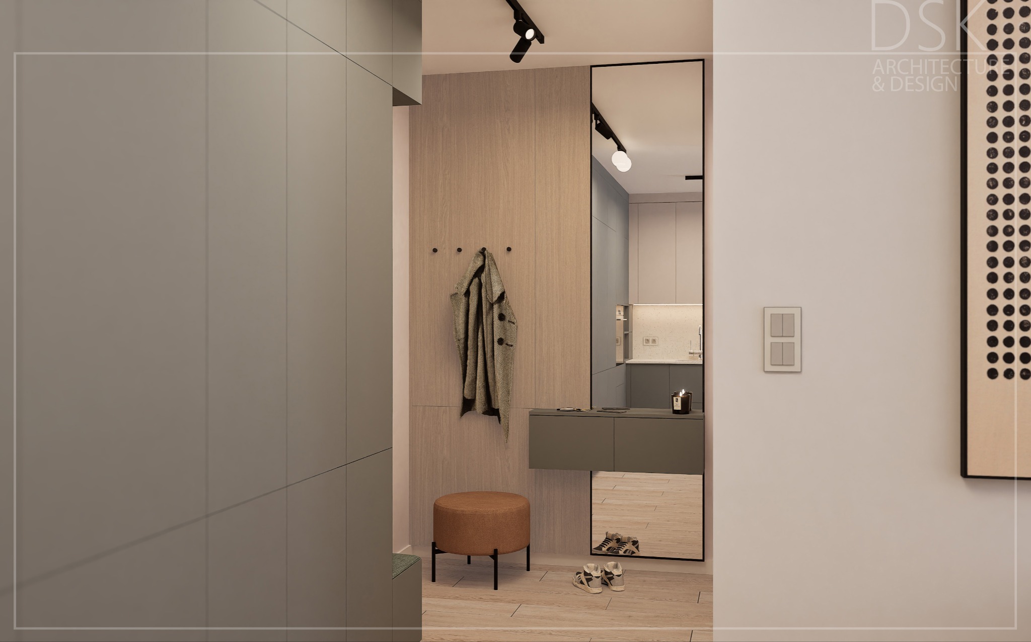 Nowoczesny przedpokój w neutralnych barwach: szarość, beż i brąz. W tle lustro w czarnej ramie, oświetlenie punktowe i minimalistyczne dodatki. Widoczny wieszak i pufa.