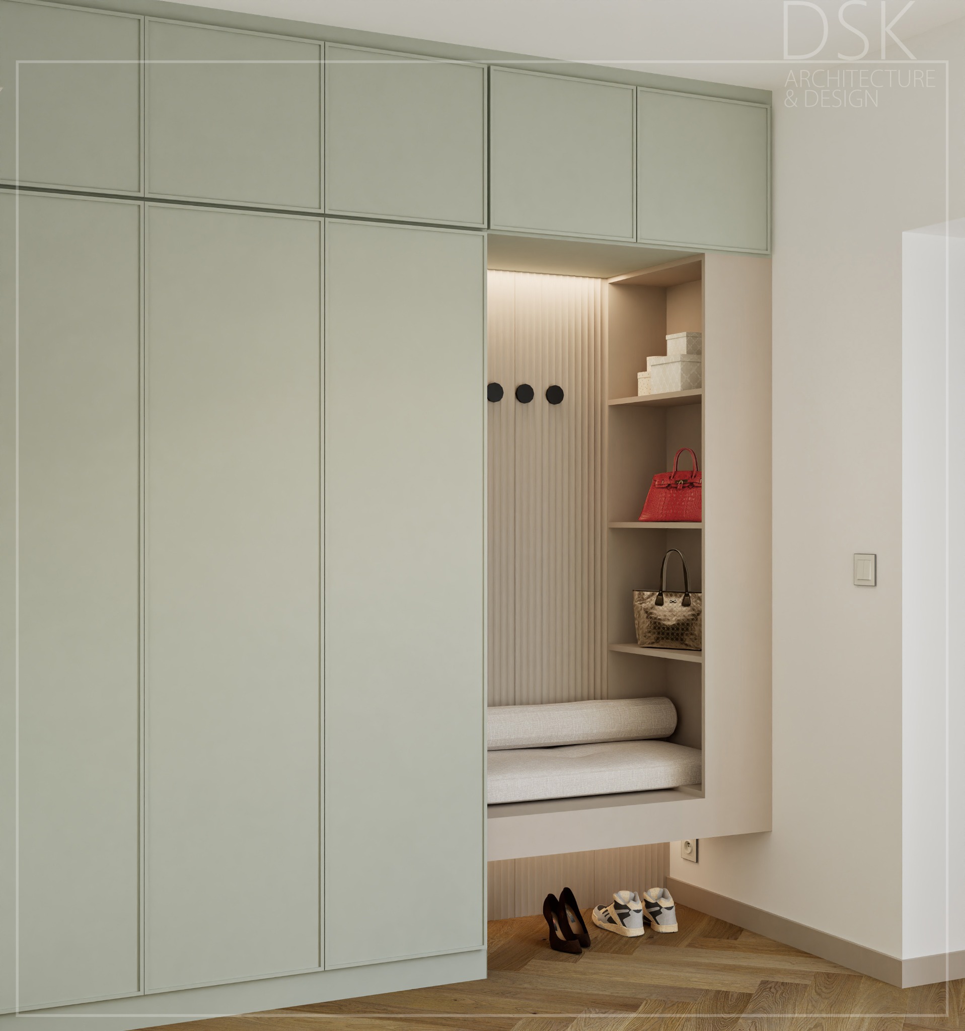 Jasnozielona zabudowa meblowa z wnęką na siedzisko i półki na torebki. Na podłodze parkiet w jodełkę, damskie szpilki i sportowe buty. Minimalistyczny design.