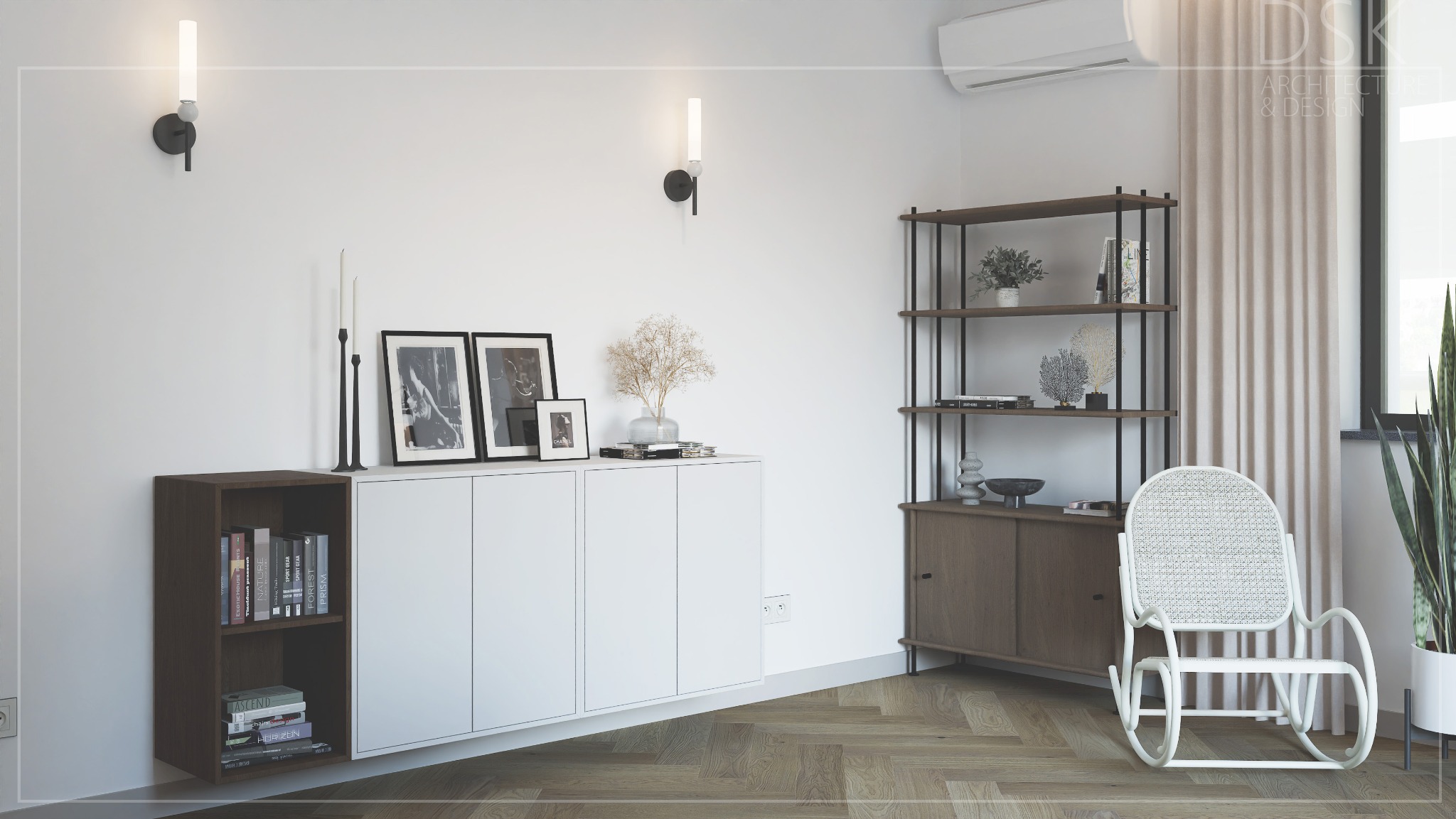 Jasne wnętrze: biała komoda z dekoracjami, regał z książkami i ozdobami, fotel bujany. Parkiet w jodełkę, minimalistyczne lampy ścienne, klimatyzator. Stonowana kolorystyka.