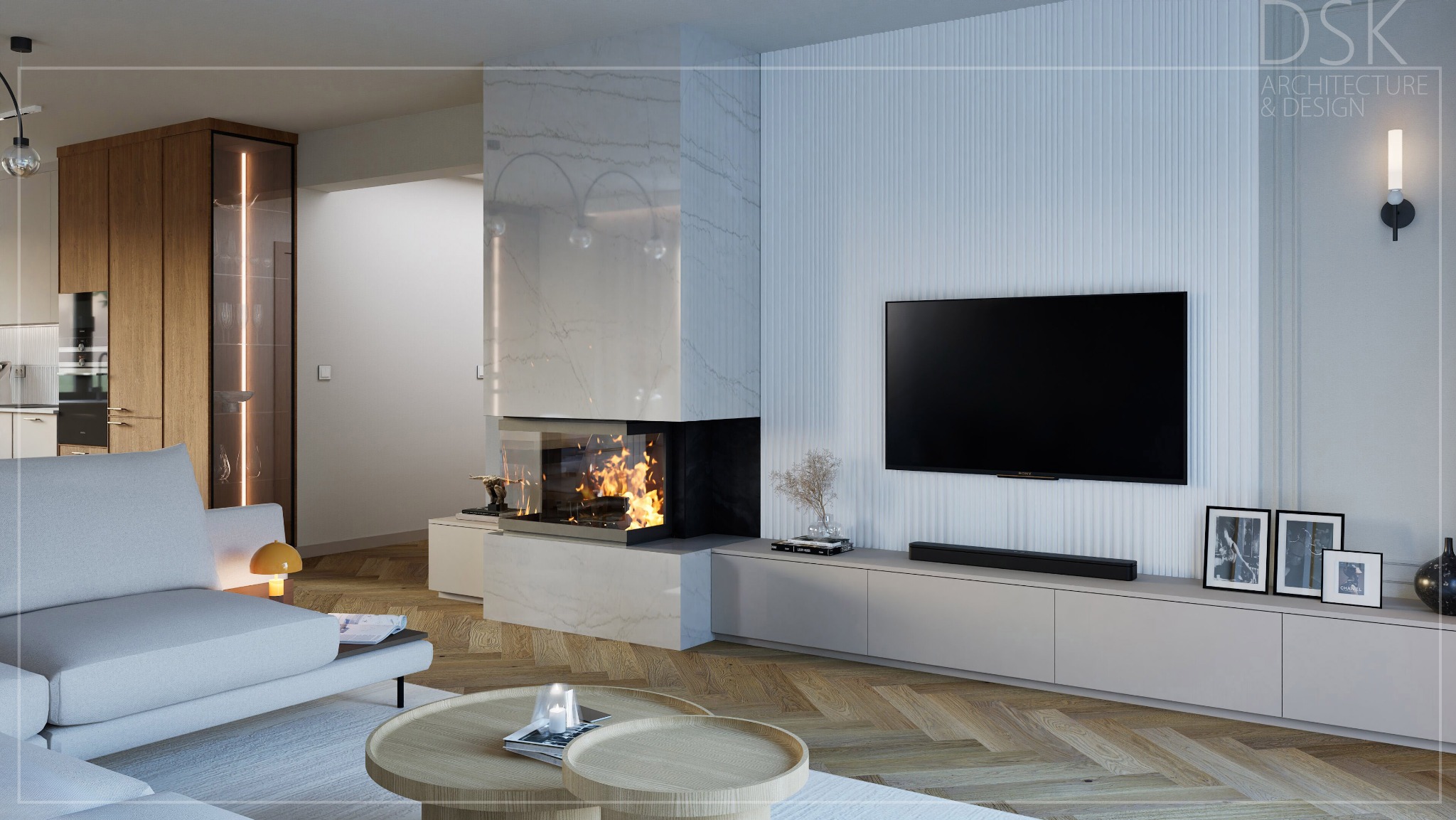 Nowoczesny salon z kominkiem obudowanym marmurem, drewnianą podłogą w jodełkę i minimalistyczną szafką RTV. Widoczny fragment sofy i stoliki kawowe.