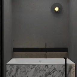 Nowoczesna łazienka z wanną obłożoną marmurem, czarną armaturą i oświetleniem LED pod wanną oraz okrągłym kinkietem na szarej ścianie.