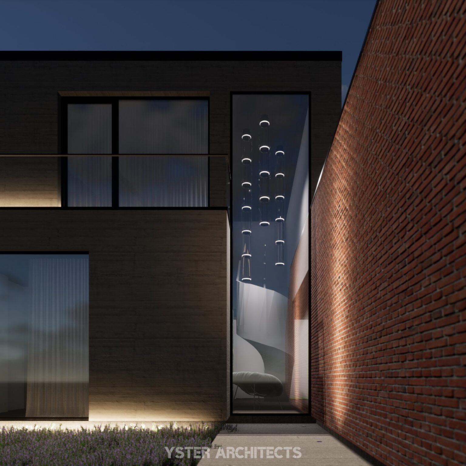 Nowoczesny budynek z ceglaną ścianą i wysokim oknem, przez które widać spiralne schody i designerskie lampy. Oświetlenie elewacji podkreśla teksturę materiałów.