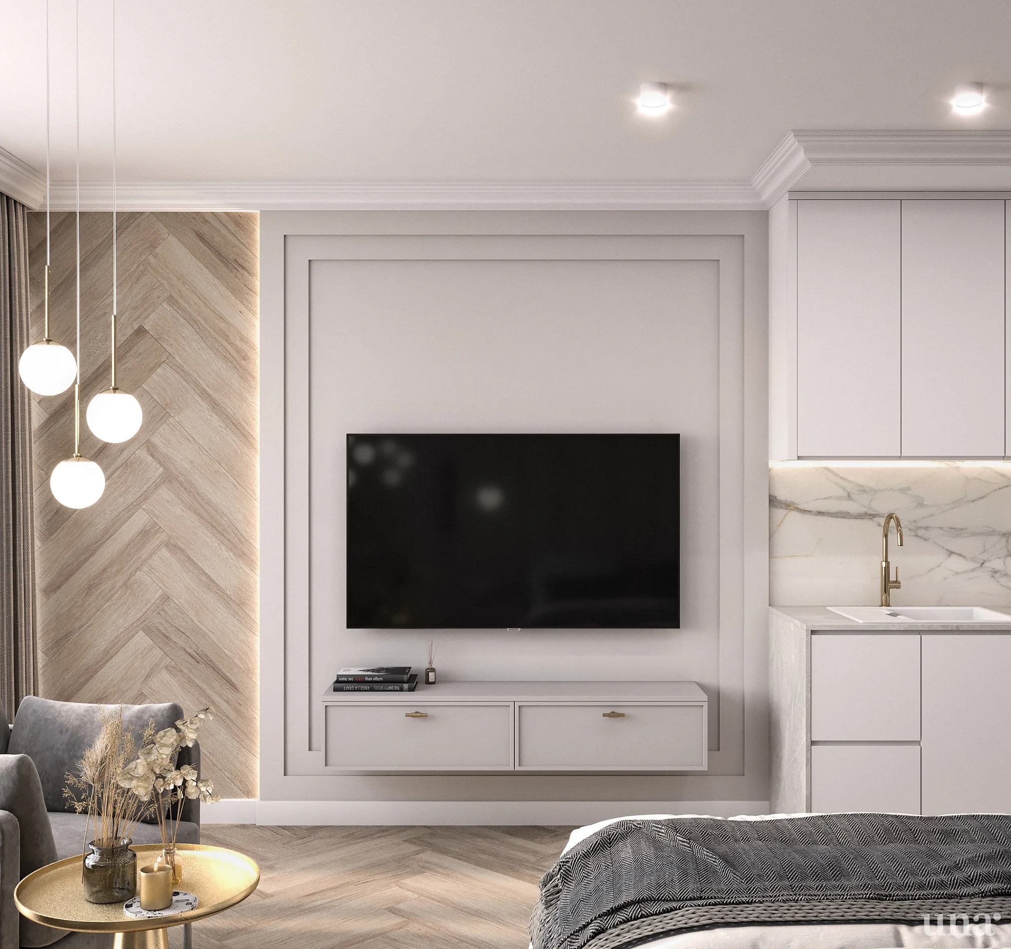 Nowoczesne studio: telewizor na ścianie z drewnianą boazerią w jodełkę, szara sofa, złoty stolik kawowy z dekoracjami, białe szafki kuchenne z marmurowym blatem i złotą armaturą.